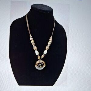 Elegant Brown Necklace with Smooth Beads and Circular Pendant
